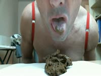 Amateur male cam model looks sexy in lingerie while displaying mouth full of warm brown scat